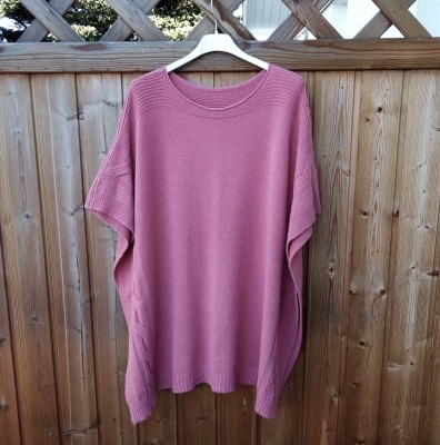 Rosa stickad poncho